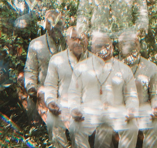 A group of men in white shirts.